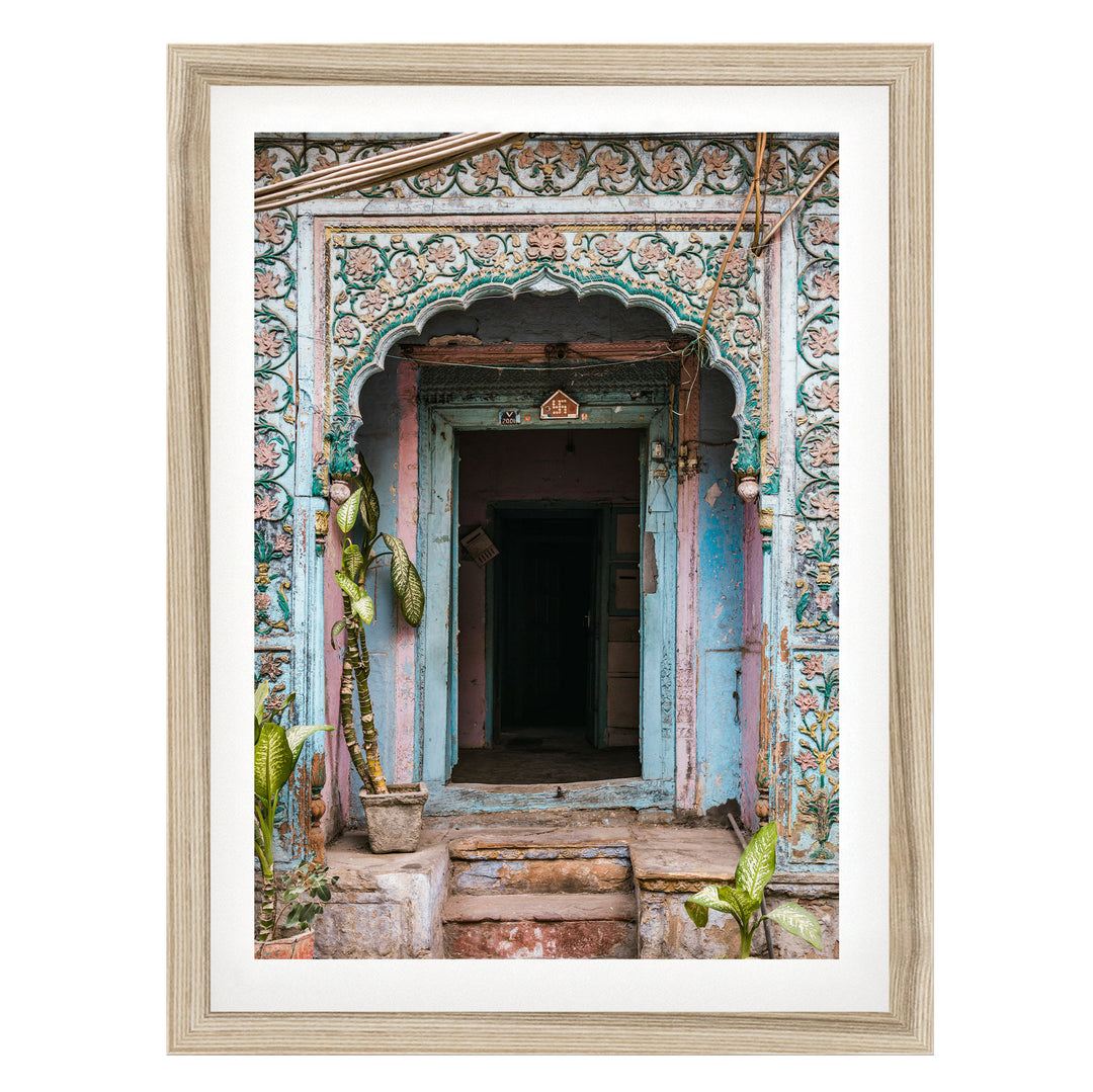a colorful, ornately decorated doorway with a wooden frame, featuring intricate patterns and designs.