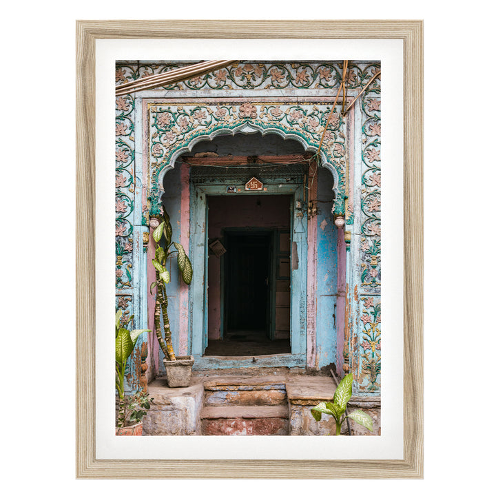 a colorful, ornately decorated doorway with a wooden frame, featuring intricate patterns and designs.