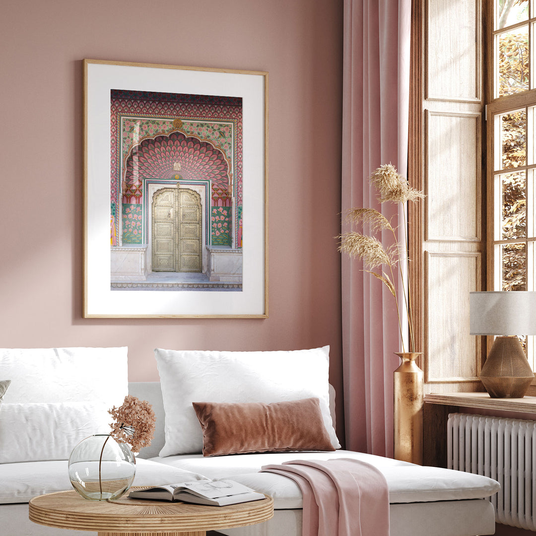 a living room with pink walls and a white couch