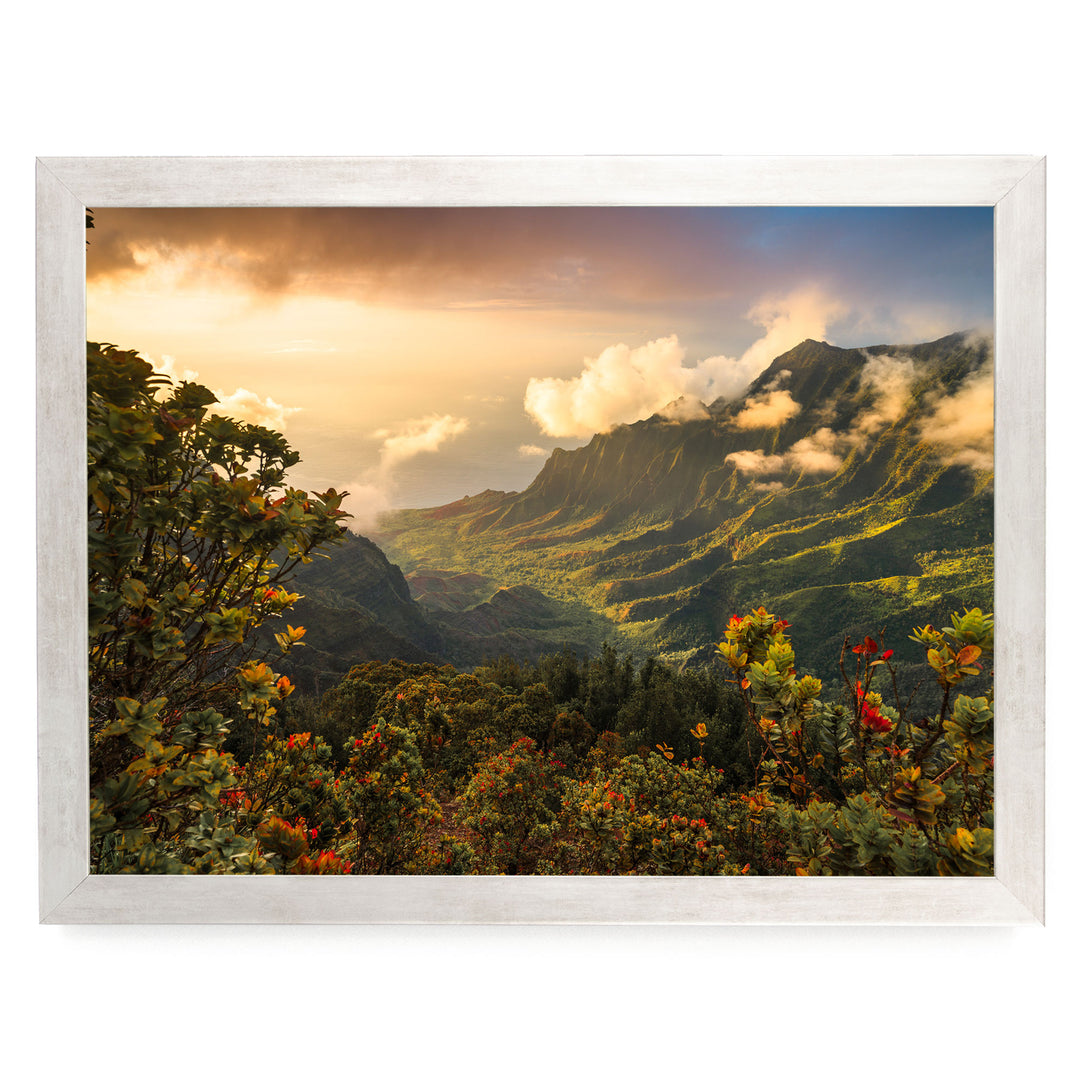 a breathtaking mountainous landscape with lush greenery, vibrant fall foliage, and a stunning sunset sky.
