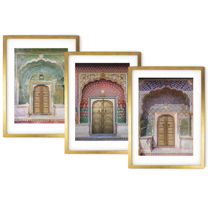 three framed paintings of doors in a building