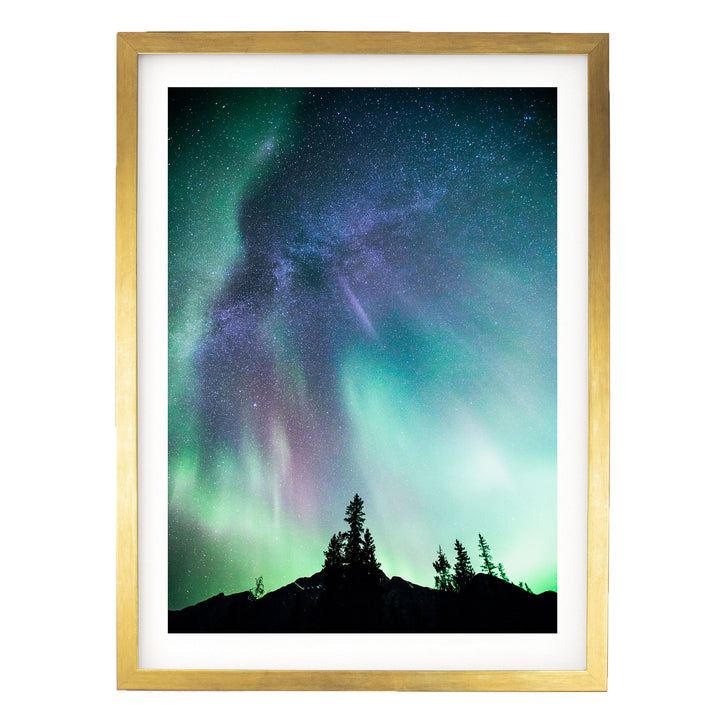 a stunning night sky with a vibrant display of the Aurora Borealis, or Northern Lights, illuminating the sky above a silhouetted mountain range.