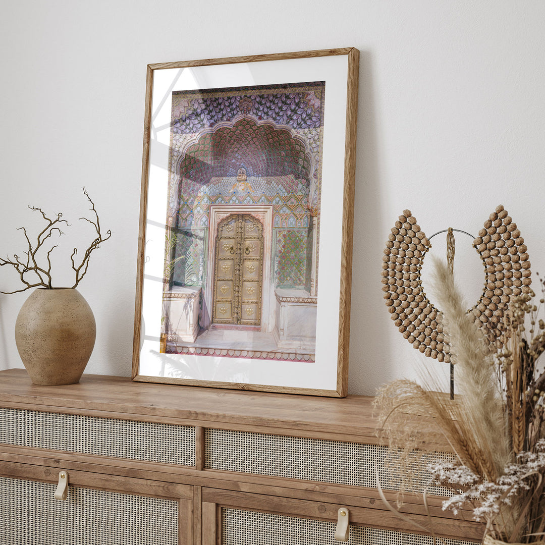 a picture of a doorway in a frame on top of a dresser