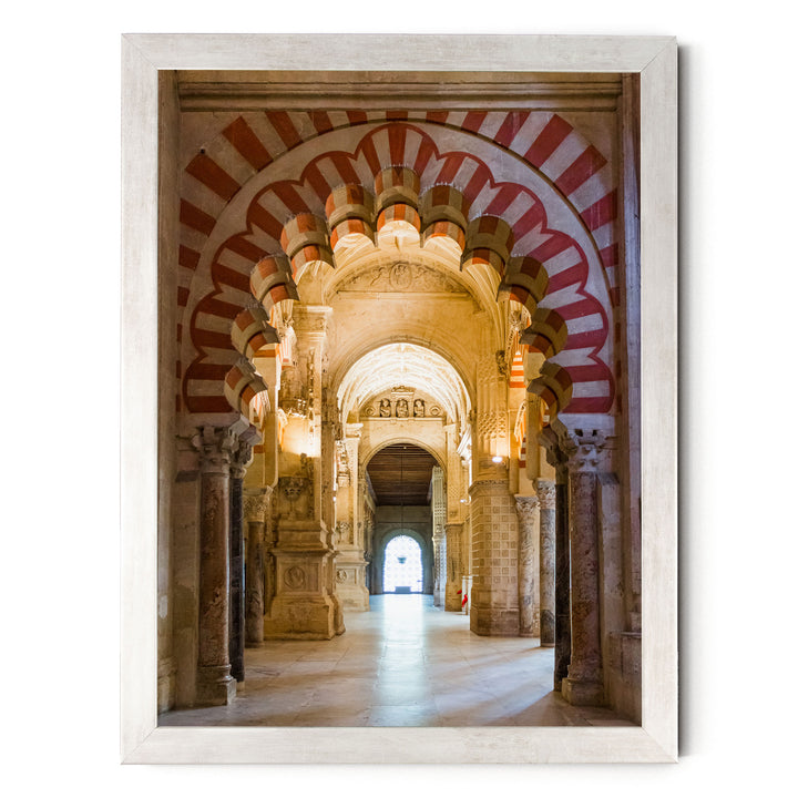 a grand, ornate hallway with arched doorways and columns, creating an impressive architectural space.