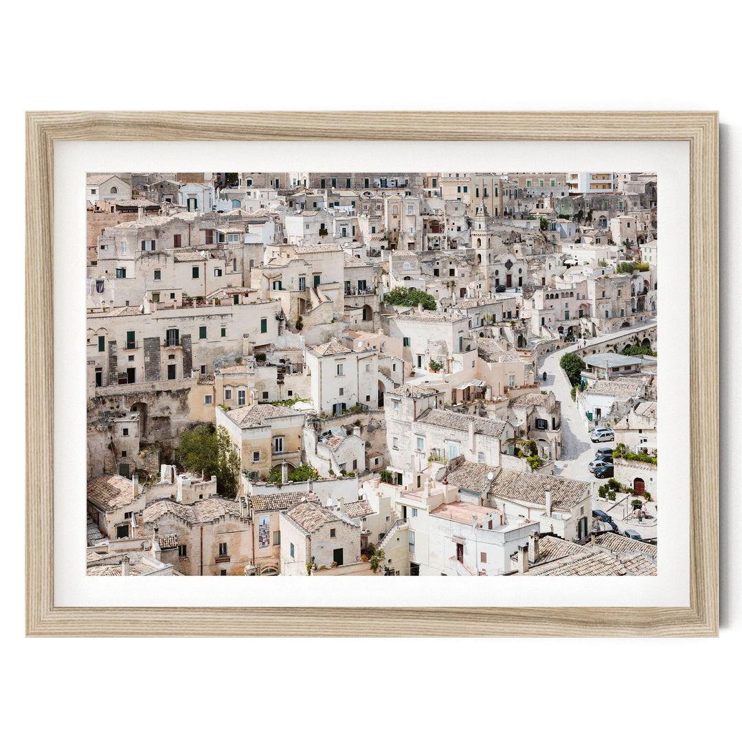 The image is a panoramic view of a densely populated city with numerous buildings and structures, showcasing the architectural diversity and layout of the urban landscape.