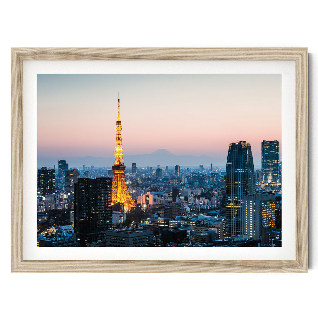 a cityscape at dusk, with the Tokyo Tower illuminated against the evening sky.