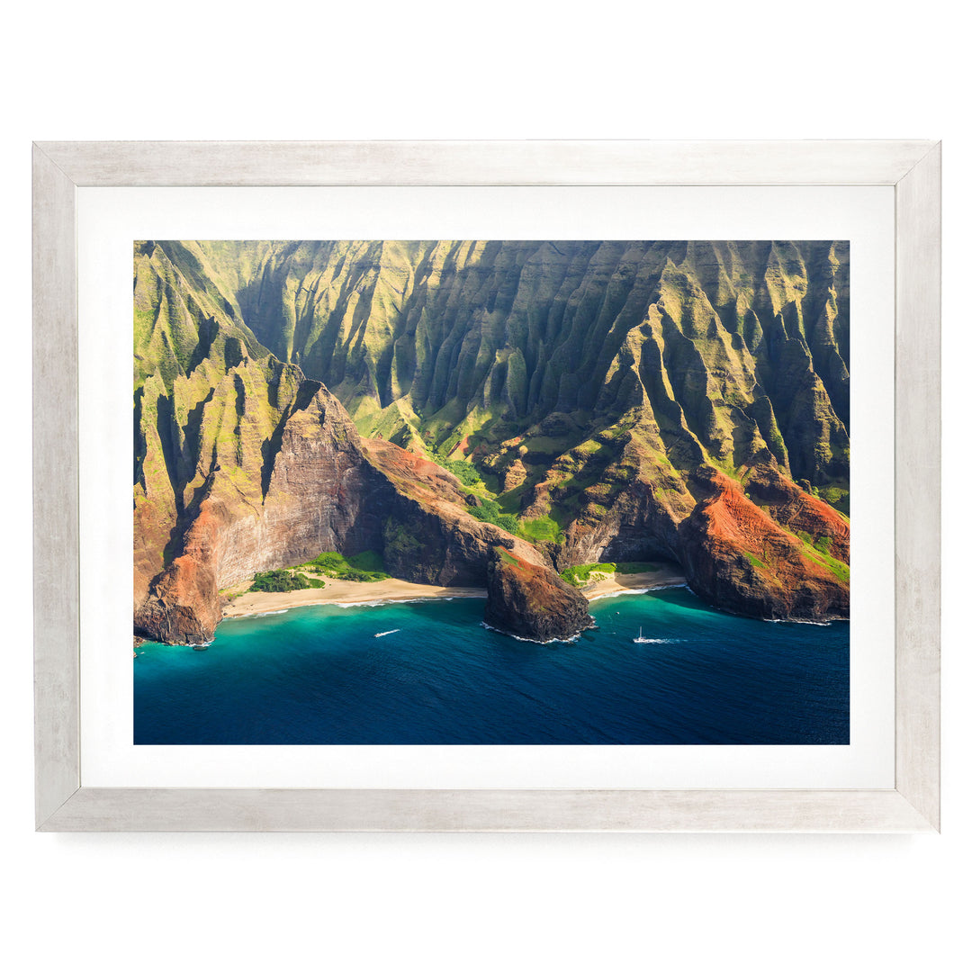 a stunning coastal landscape with towering cliffs, a deep blue ocean, and a small island in the distance.