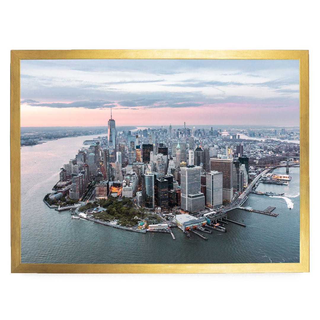 The image is an aerial view of the New York City skyline, showcasing the city's iconic skyscrapers and waterfront.