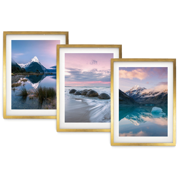 The image is a collage of three framed landscape photographs, each depicting a different natural scene. The first photograph shows a mountain range reflected in a calm lake, the second photograph captures a rocky shoreline with crashing waves, and the third photograph depicts a serene mountain lake with a sunset sky reflected in the water.