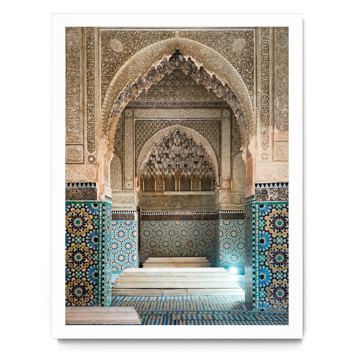 an ornate, intricately decorated interior space with a large archway and a tiled floor.