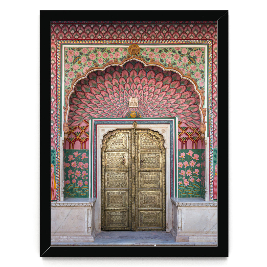 a beautifully decorated doorway with intricate patterns and vibrant colors, including pink, green, and gold elements.