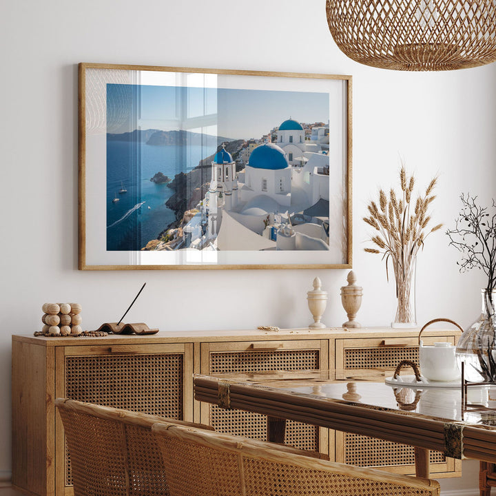 Blue Santorini, Oia, Greece framed print hanging in a styled interior