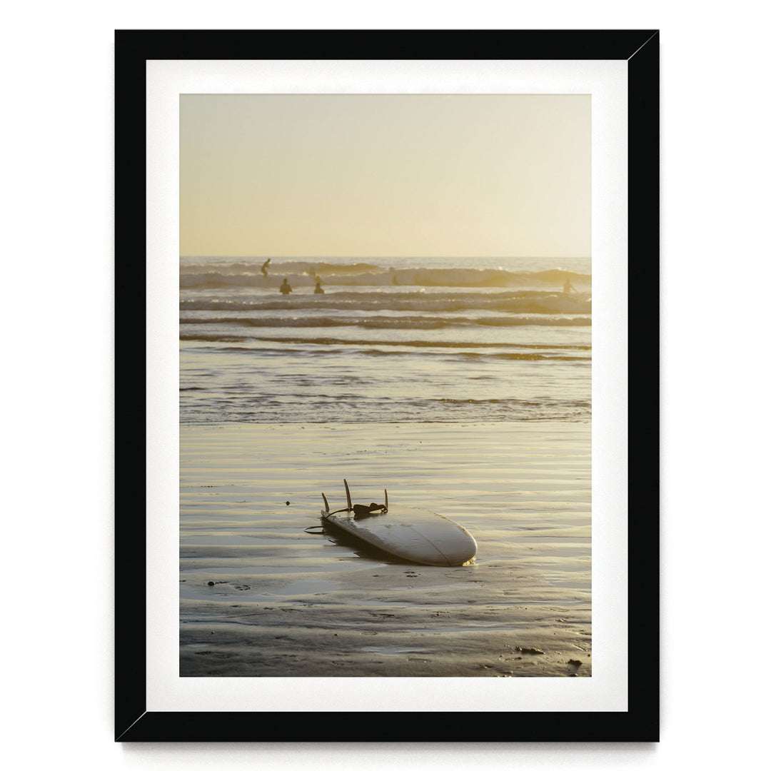 Surfboard at Sunset, Costa Rica print in a black frame with white mat