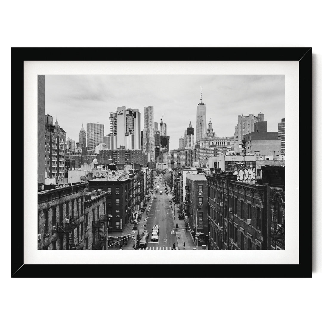 Lower Manhattan Street View, New York City – B&amp;W print in a black frame with white mat