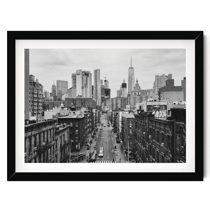 Lower Manhattan Street View, New York City – B&amp;W print in a black frame with white mat