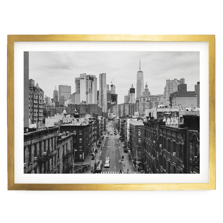 Lower Manhattan Street View, New York City – B&amp;W print in a gold frame with white mat
