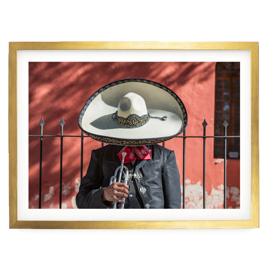 Mexican charro print in a gold frame with white mat