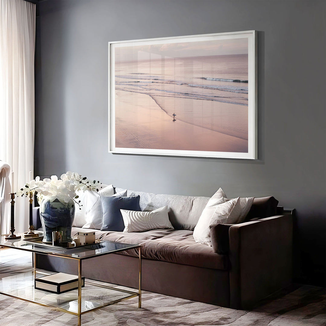 Lone Surfer on a Pink Beach I, Costa Rica print displayed in a bedroom setting