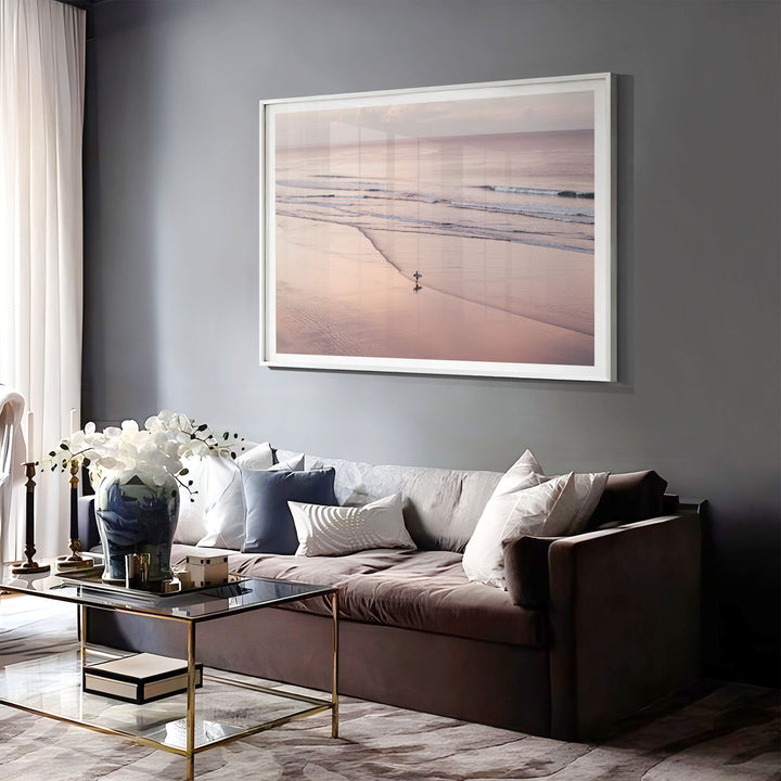 Lone Surfer on a Pink Beach I, Costa Rica print displayed in a bedroom setting