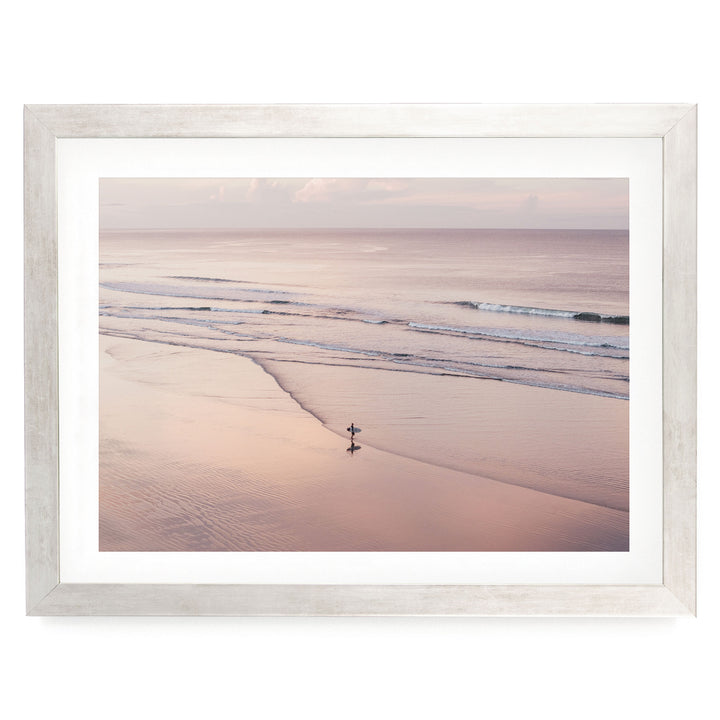 Lone Surfer on a Pink Beach I, Costa Rica print in a silver frame with white mat