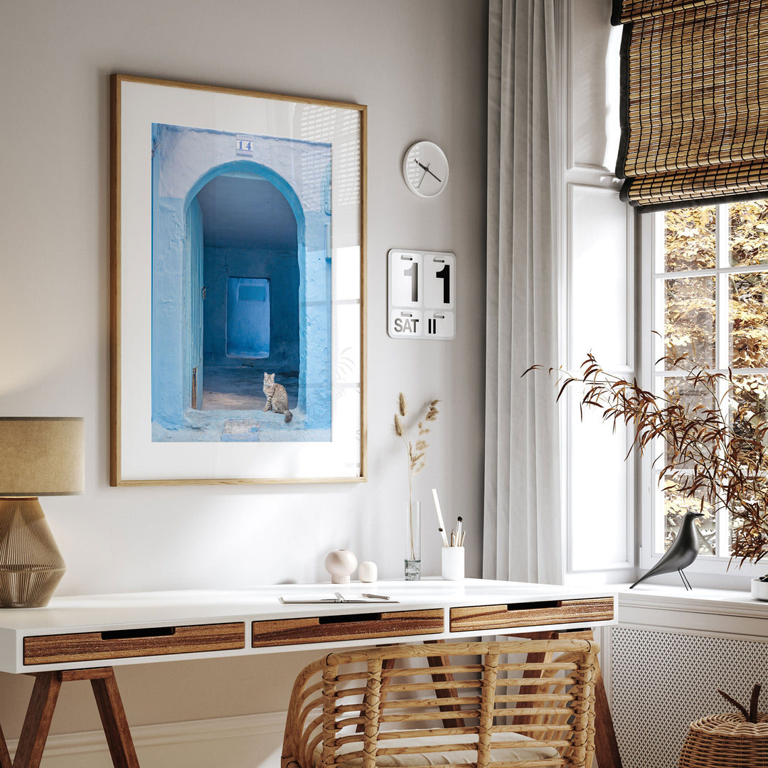 Cat in the Blue Doorway, Chefchaouen, Morocco framed print hanging in a styled interior