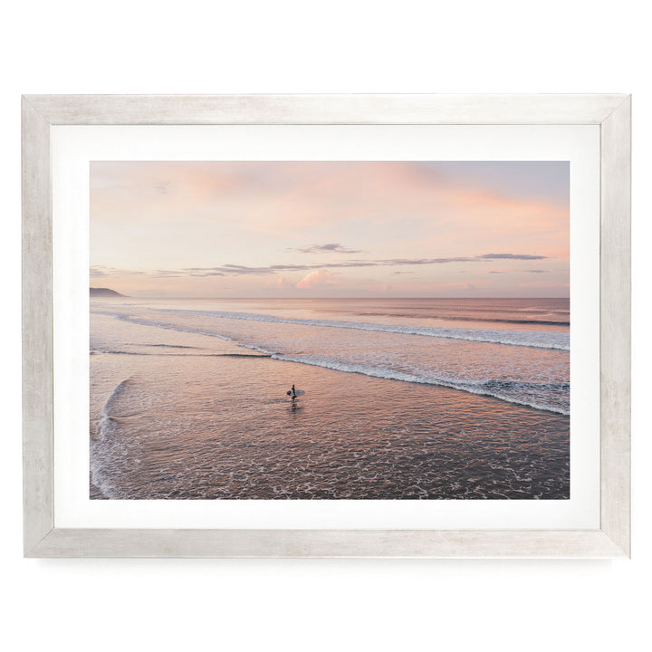 Lone Surfer on a Pink Beach II, Costa Rica print in a silver frame with white mat