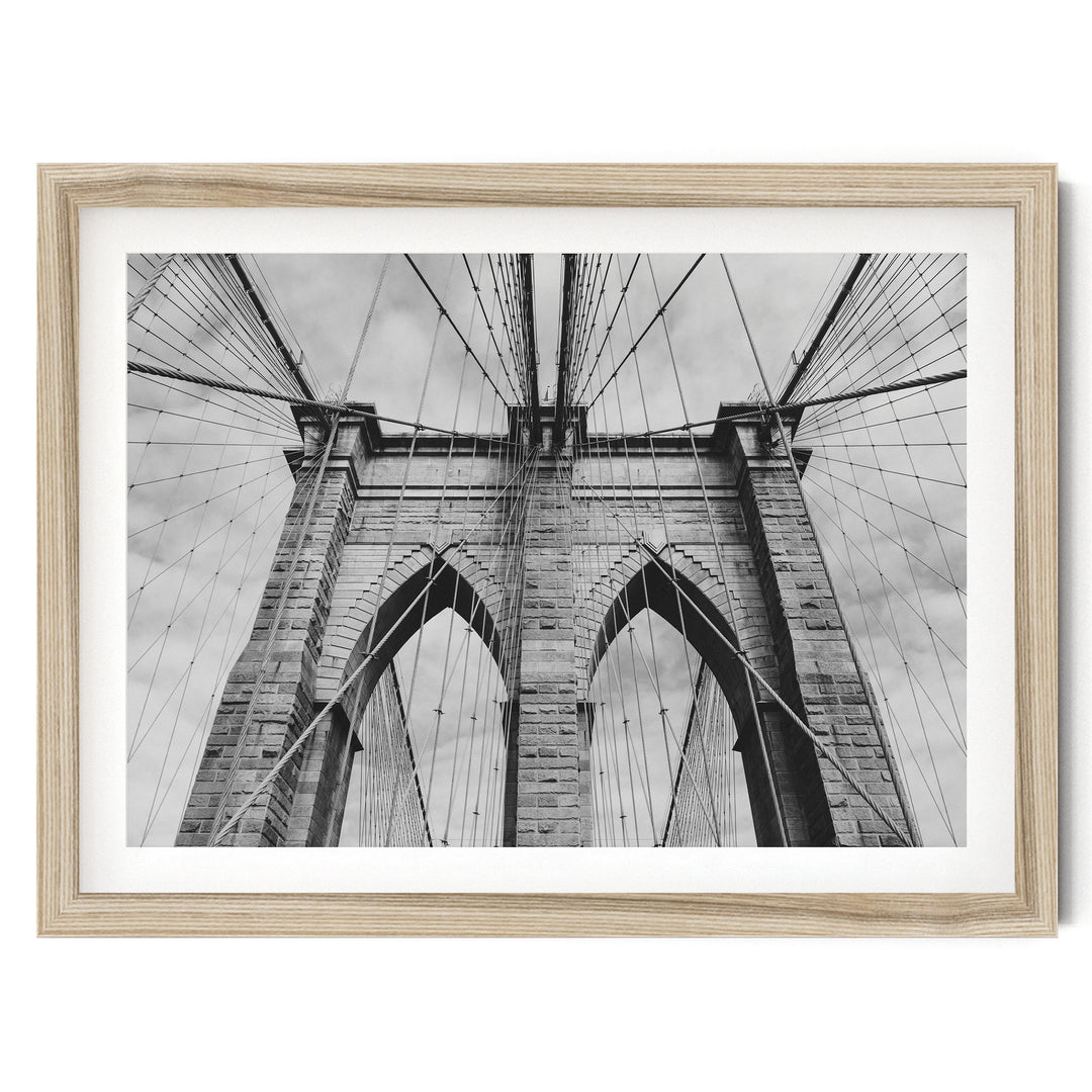 Brooklyn Bridge Tower, New York City – B&W fine art print in a natural wood frame with white mat