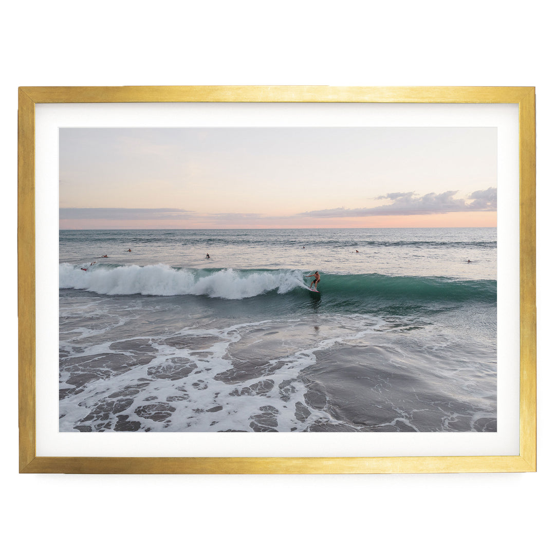 Riding the Wave at Sunset II, Costa Rica print in a gold frame with white mat