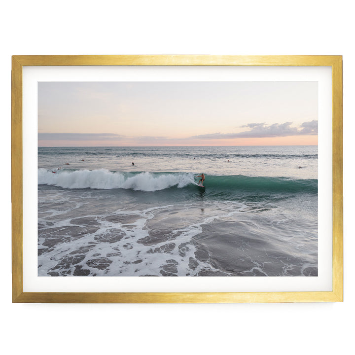 Riding the Wave at Sunset II, Costa Rica print in a gold frame with white mat