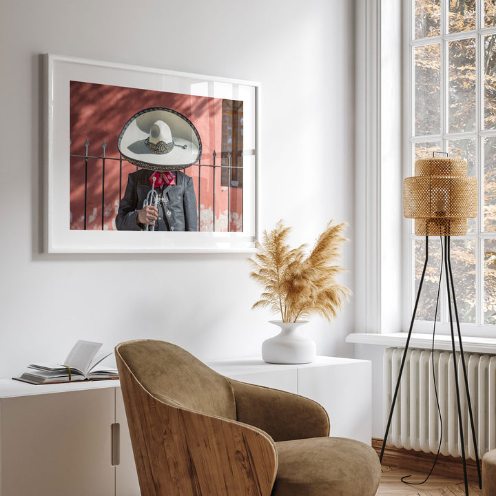 Framed Mexican charro print on a wall in a bright modern room