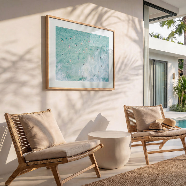 Framed Bondi Beach surfers print on a wall in a bright room