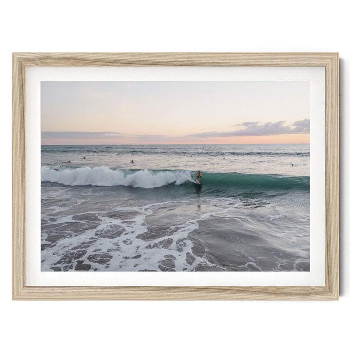 Riding the Wave at Sunset II, Costa Rica fine art print in a natural wood frame with white mat