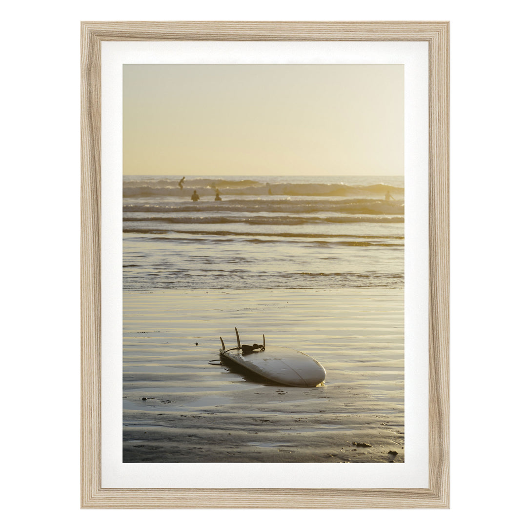 Surfboard at Sunset, Costa Rica fine art print in a natural wood frame with white mat