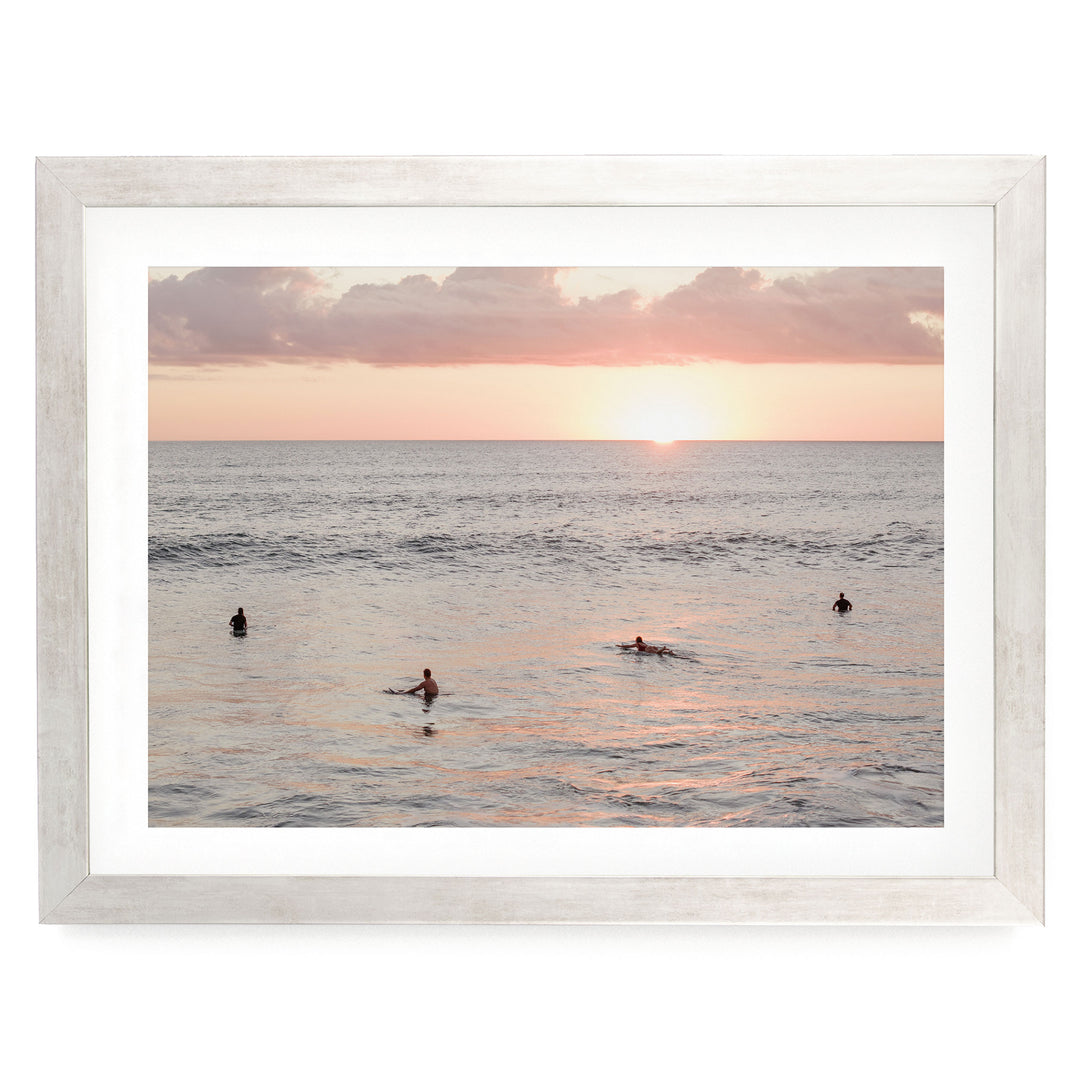 Surfers Waiting at Sunset, Costa Rica print in a silver frame with white mat