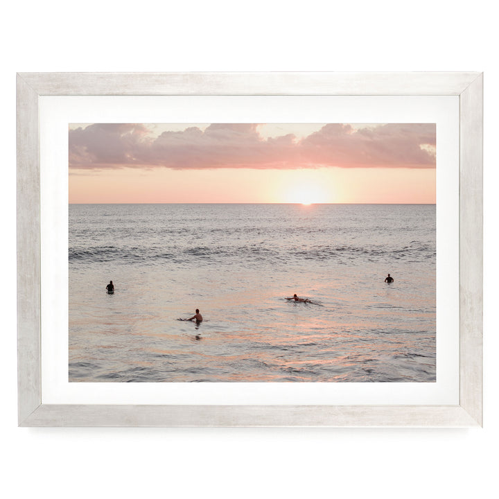 Surfers Waiting at Sunset, Costa Rica print in a silver frame with white mat