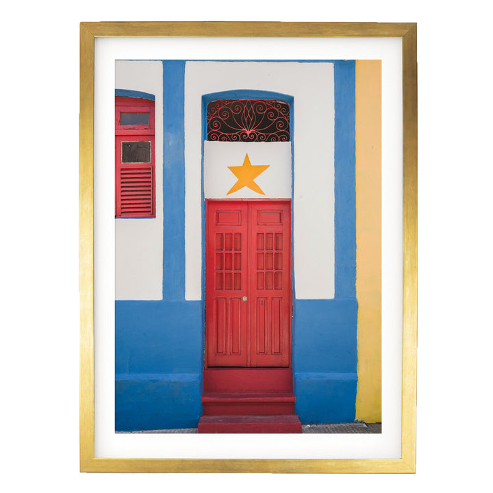 Red Door with Yellow Star, Olinda, Brazil print in a gold frame with white mat