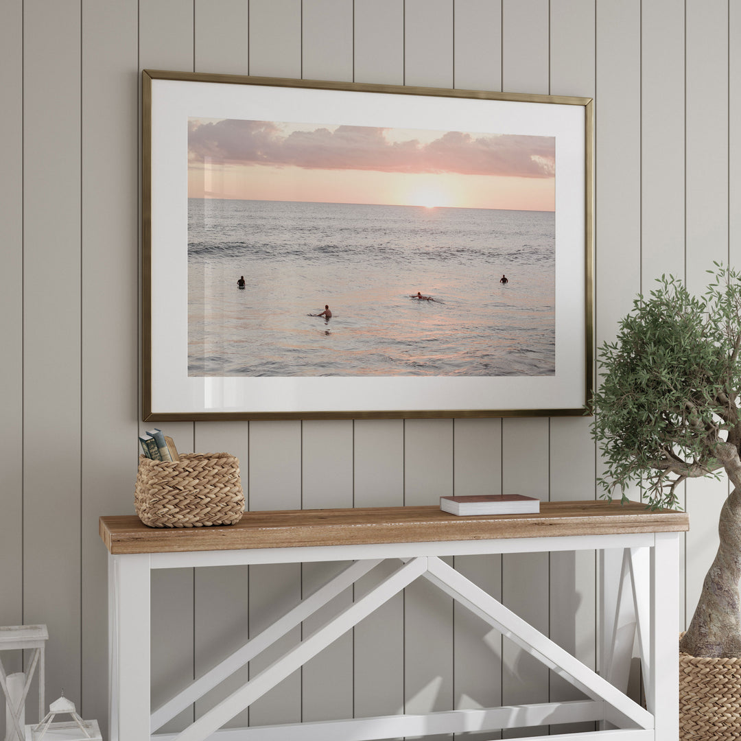 Surfers Waiting at Sunset, Costa Rica framed wall art in a home interior