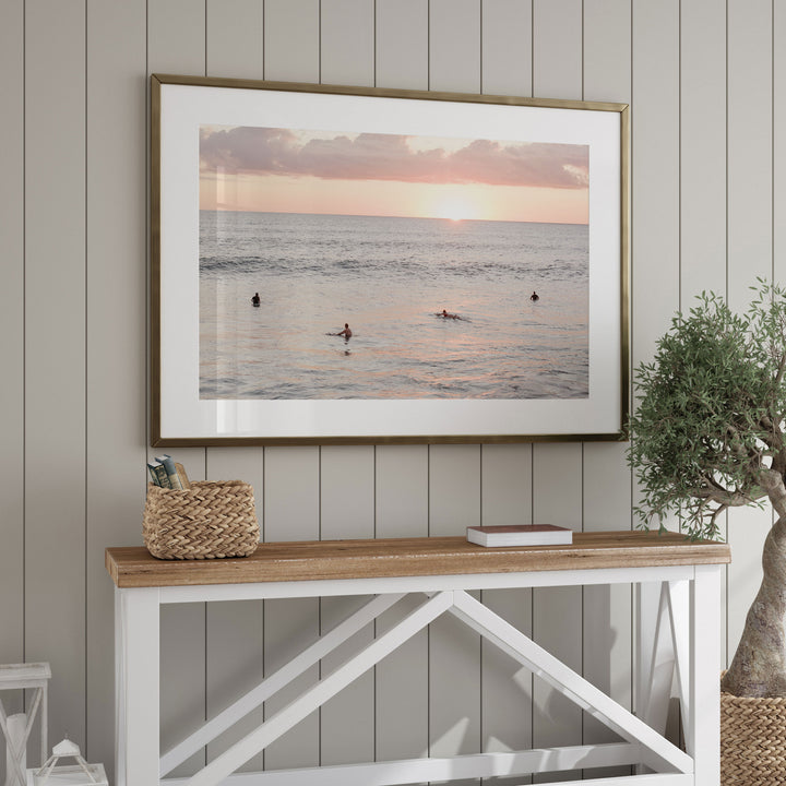 Surfers Waiting at Sunset, Costa Rica framed wall art in a home interior