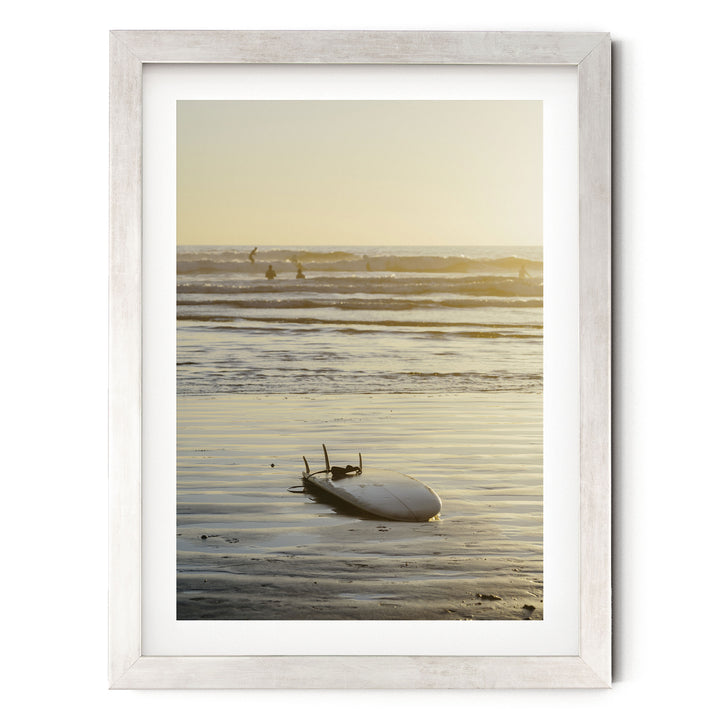 Surfboard at Sunset, Costa Rica print in a silver frame with white mat