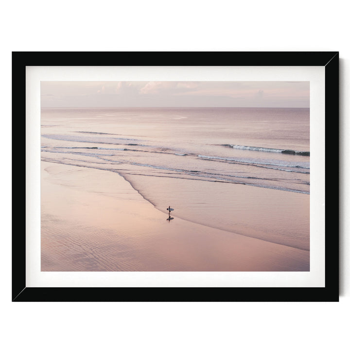 Lone Surfer on a Pink Beach I, Costa Rica print in a black frame with white mat