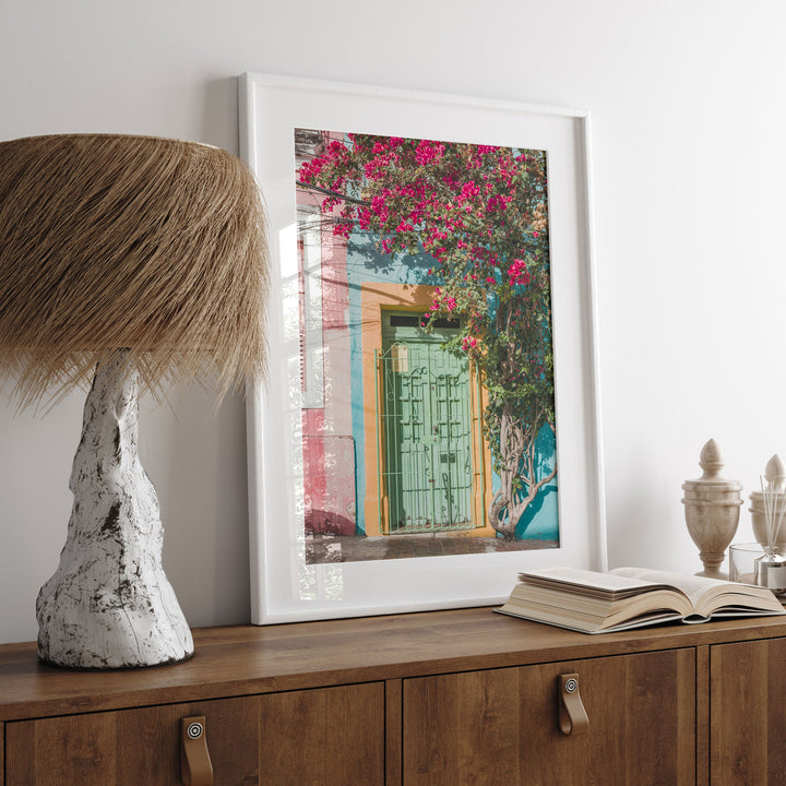 Bougainvillea and Green Door I, Olinda, Brazil print displayed in a bedroom setting