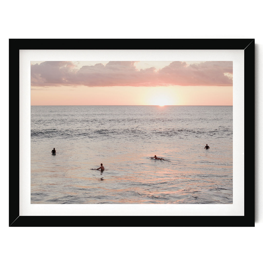 Surfers Waiting at Sunset, Costa Rica print in a black frame with white mat