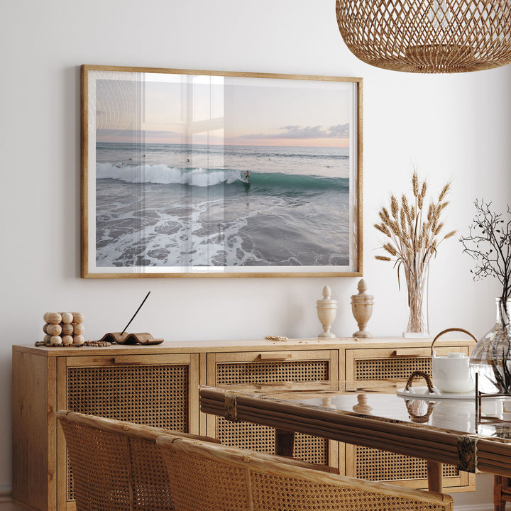 Riding the Wave at Sunset II, Costa Rica framed print hanging in a styled interior