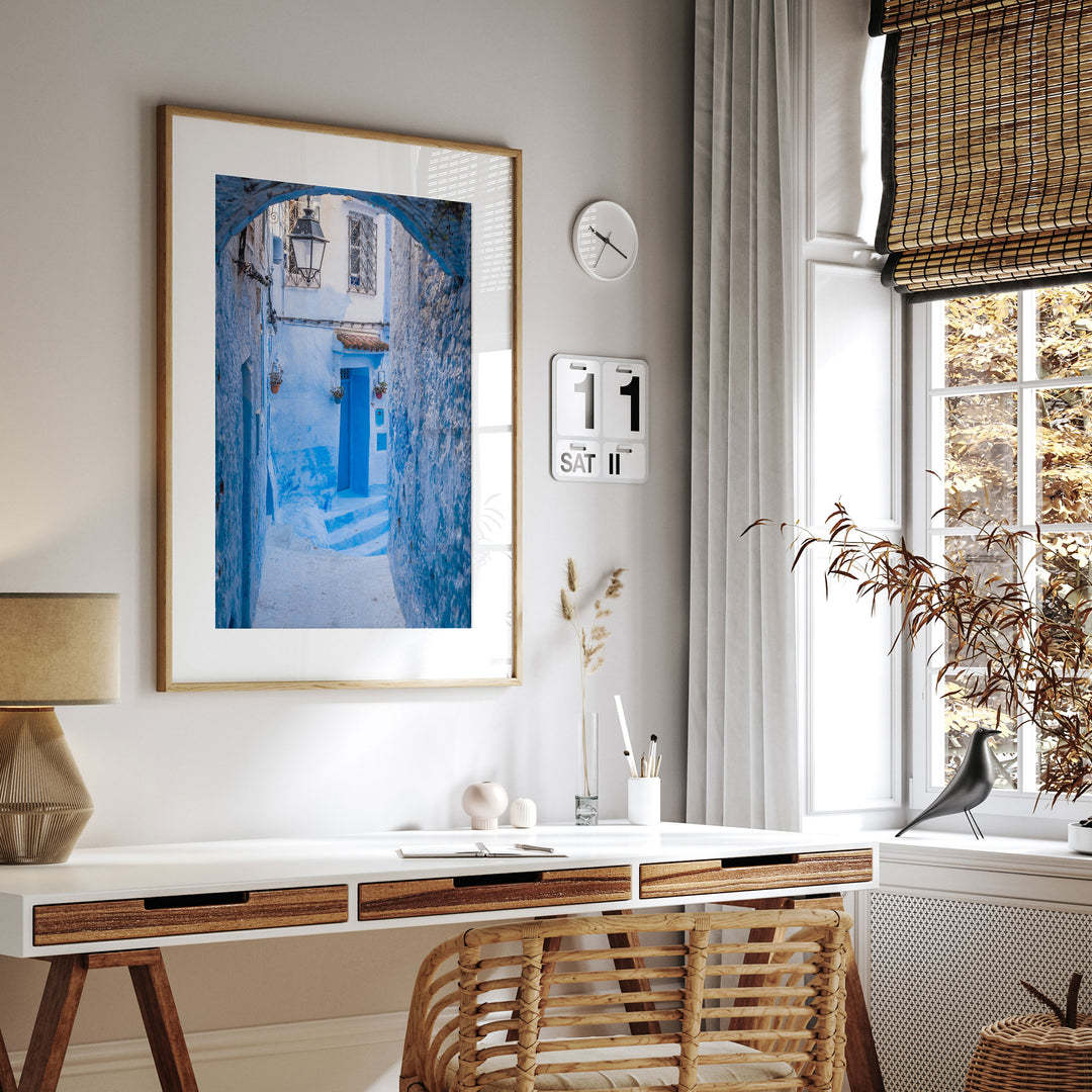 Blue Alley with Lantern, Chefchaouen, Morocco framed print hanging in a styled interior