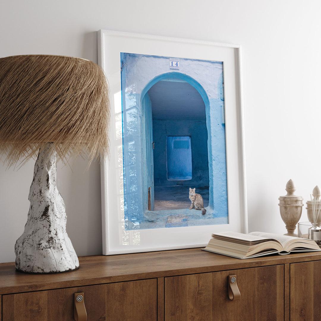 Cat in the Blue Doorway, Chefchaouen, Morocco print displayed in a bedroom setting