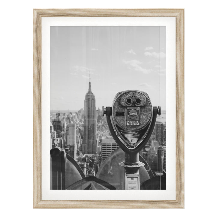 Binoculars and Empire State Building, New York City – B&amp;W fine art print in a natural wood frame with white mat