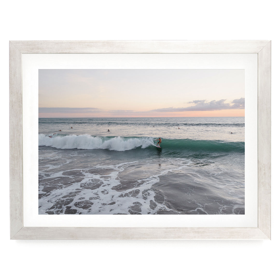 Riding the Wave at Sunset II, Costa Rica print in a silver frame with white mat