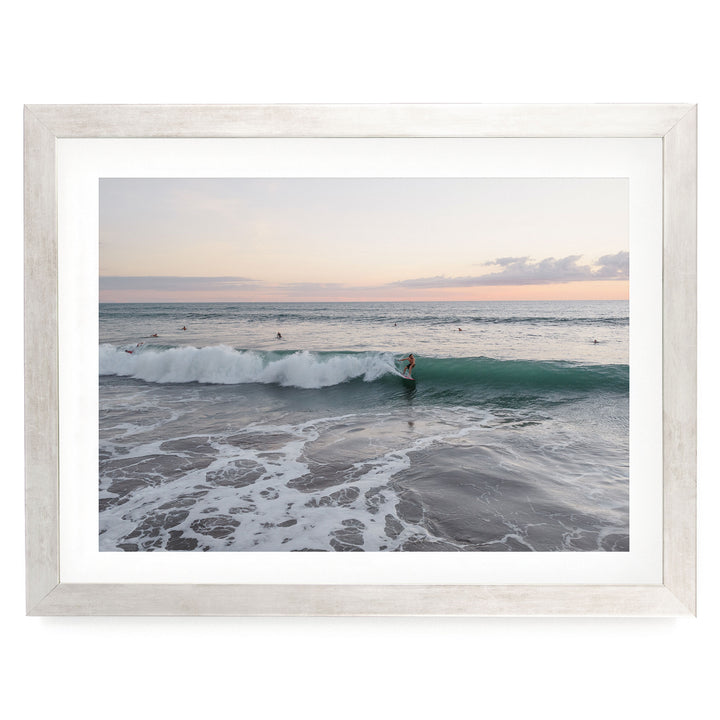 Riding the Wave at Sunset II, Costa Rica print in a silver frame with white mat