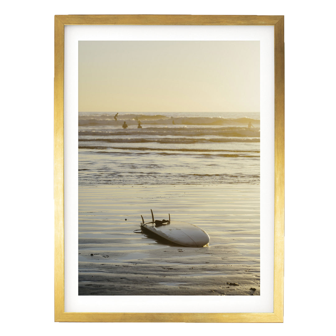Surfboard at Sunset, Costa Rica print in a gold frame with white mat