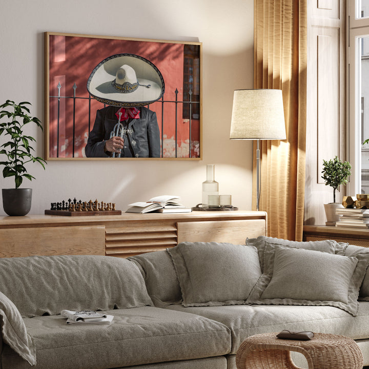 Framed Mexican charro print displayed in a cozy living room